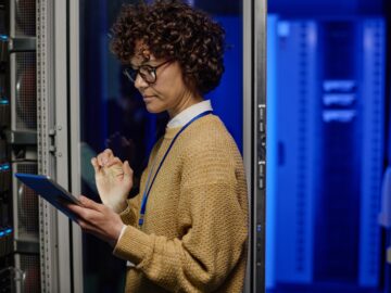 Engineer checking the work of computer network