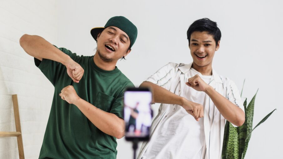 Friends dancing tiktok, recording by smartphone
